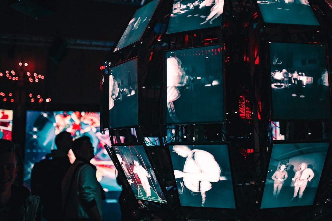 Production team monitoring multiple video feeds on screens